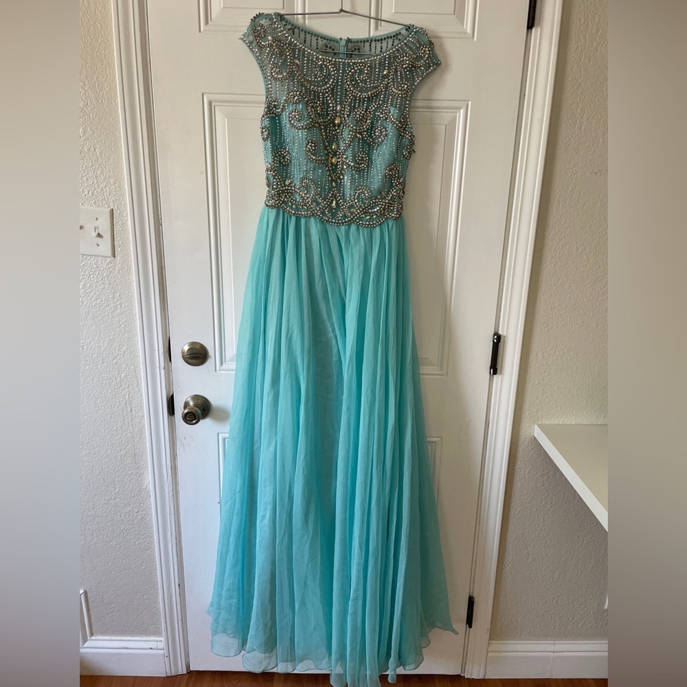 Blue prom dress, size 4. The tag says size 8 but it was resized to 4.